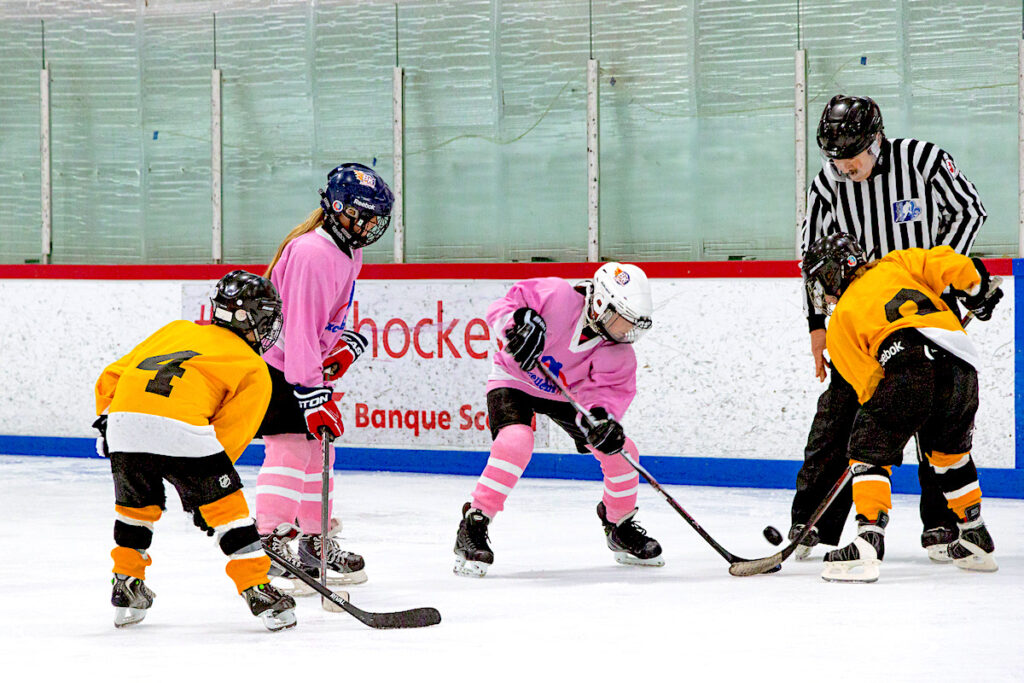 Children play hockey in Excellent Ice Kirkland's Youth Pond Hockey League